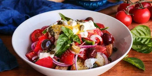 recipe image Salad with tomatoes, homemade milk-cheese and herb dressing